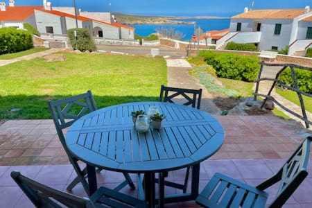 Arenal d'en Castell Apartment | Ponent - Planta baja con vistas al mar y piscinas