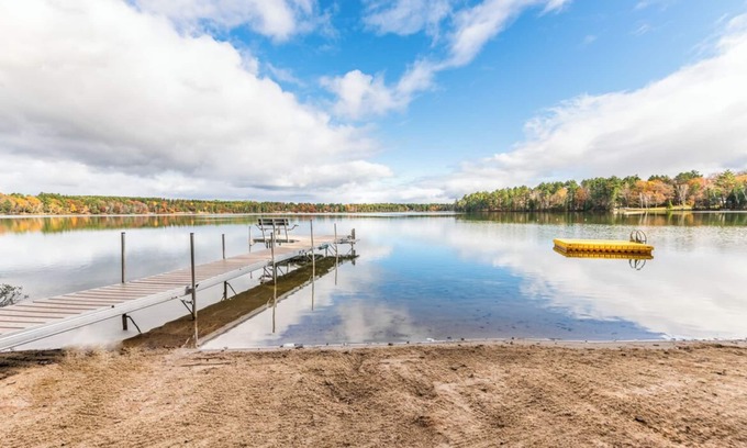 Eagle River House | Porch in the Pines | Lakefront home w/AC! Sandy Beach, Dock, Dogs OK
