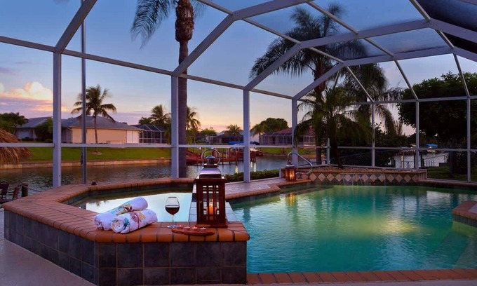 Caloosahatchee Villa | Pretty Waterfront Home w/Heated Pool/Spa + Tiki