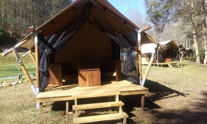Murphy RV Rental | Relax in a Safari Glamp Tent beside the creek, firepit- outdoor experience.