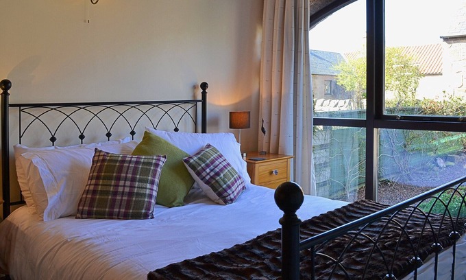 Belford Cottage | Renovated cart shed with enclosed gardens and views towards Holy Island.