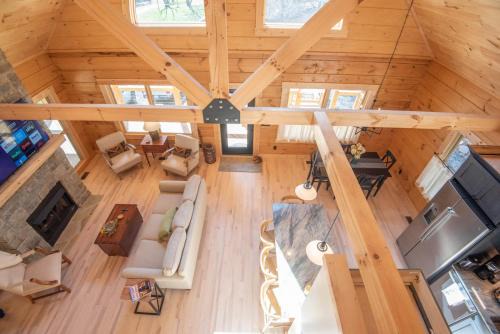 Warrensville House | Riverstead Cabin- Riverfront, Wrap Around Porch, Hot Tub & More