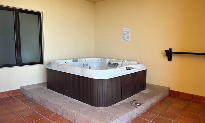 Paraiso Escondido Resort | Room with a view of the Pacific and a private Jacuzzi at Sunset Beach Resort