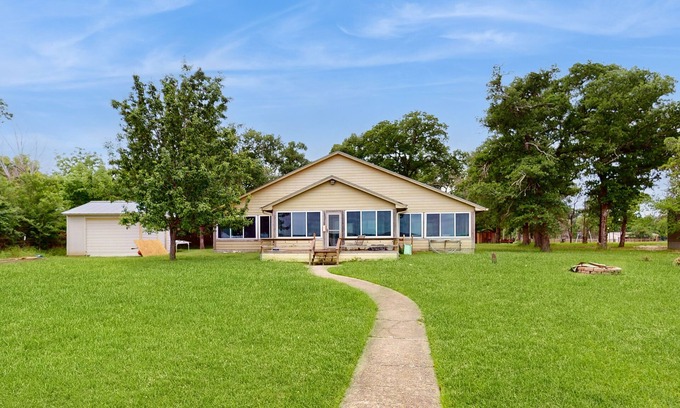 Cotton Gin House | Rural & unique waterfront home on Lake Limestone w/dock, waterslide & sunroom