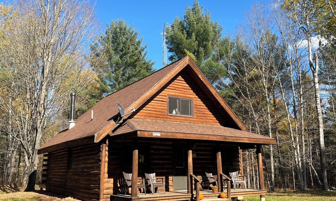Crystal Falls Cabin | Rustic Forest Getaway has the comforts of home surrounded by woods and water.