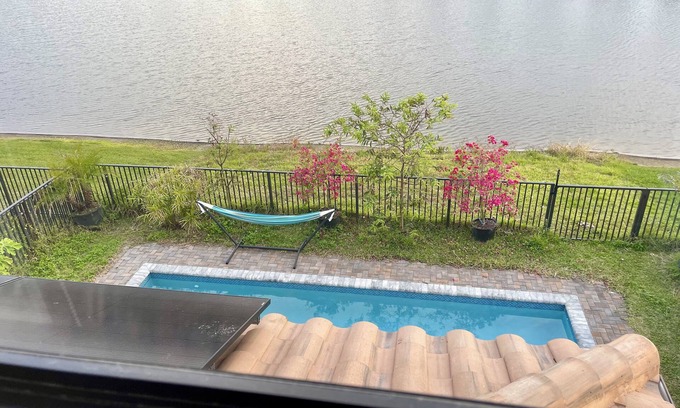 Immokalee House | Saltwater Heated Pool Lakeview House Perfect for Family Getaway & Group Retreat
