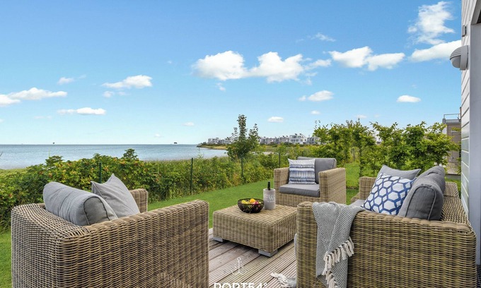 Olpenitz Apartment | Sea view - 1st row on the water, terrace, ground floor, sauna, bathtub, electric grill