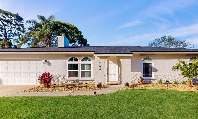 Palm Bay House | Snowbird-friendly home with open layout, enclosed yard, smart TV, AC, & W/D