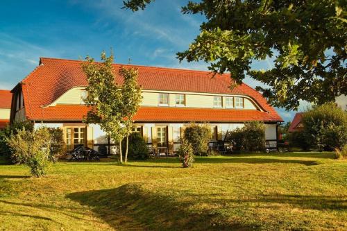 Kreptitz Apartment | strandnahe Ferienwohnung mit eigener Terrasse - Feriendorf Bakenberg FeWo D06