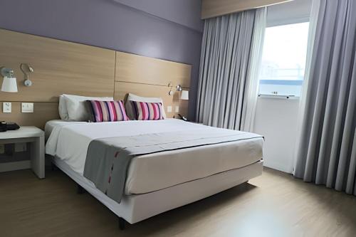 Pompeia Hotel | Suíte em flat no Gonzaga Stay Helbor