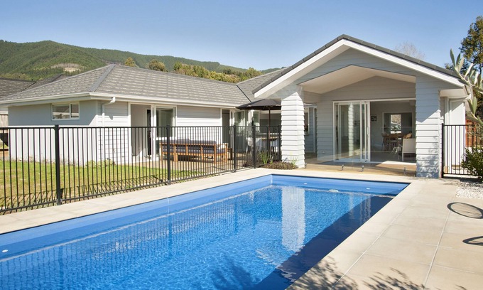 Richmond House | Sunny & spacious modern home with heated swimming pool.
