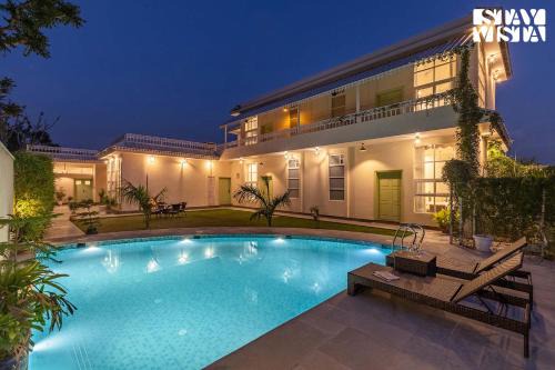 Amer Villa | The Pastel Courtyard with Pvt Pool & Garden at Jaipur by StayVista