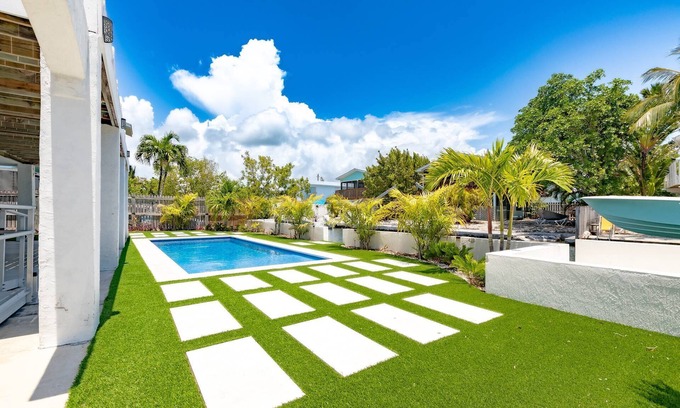 Cutthroat Harbor Estates House | The Salty Sailfish: Live the Keys Life, Stunning Canal Front Home, Pool, Dock & Dog-Friendly Bliss!