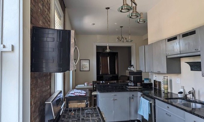 The Gate Apartment | Unique Condo in Historic Building with Rooftop Deck.