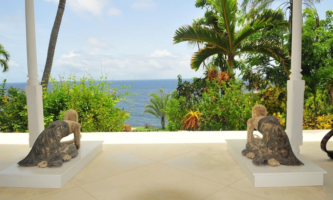 Trents Villa | Unique, Secluded Corral Stone Villa with large gardens and private beach access