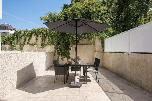 San Lorenzo Apartment | Urban Oasis near Termini, free Parking&Patio, int3