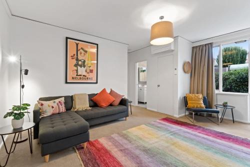 Prahran Apartment | Urban Retro - Experience Vibrant Courtyard Charm