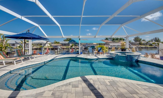 Matlacha Isles Villa | Fun'n Sun-Charming 3 BR/3 baths waterfront villa- pool, spa, dock, fishing poles