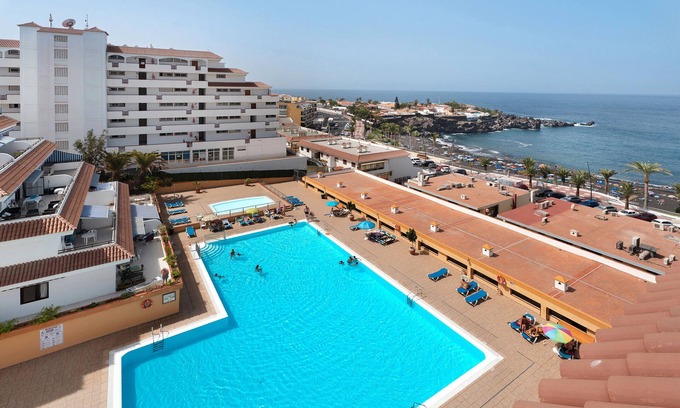Santiago del Teide Apartment | Vacation Apartment 'Carpediem Playa La Arena' with Sea View, Shared Pool and Wi-Fi