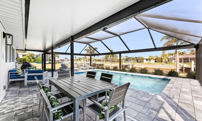 Punta Gorda Apartment | Villa Capri | Waterfront Luxury Retreat Heated Saltwater Pool Dock