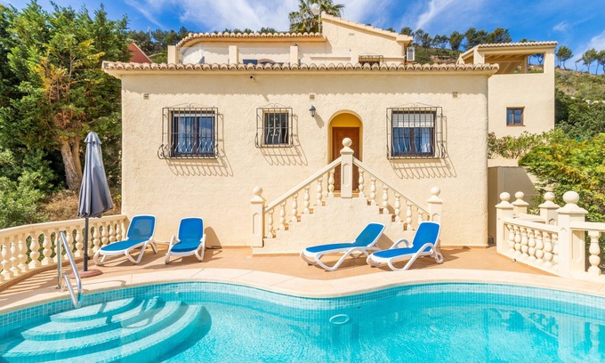 Benitachell Villa | Villa 'Vista Ibiza' with Sea Views, Private Pool, Garden, Balcony, Wi-Fi & A/C
