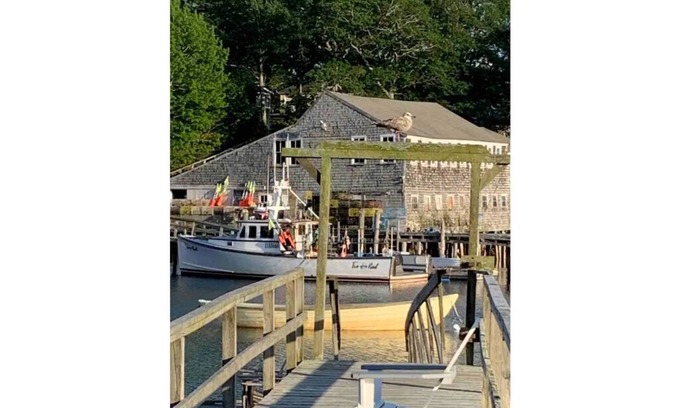 New Harbor Cottage | Vintage cabin perched on edge of harbor with dock