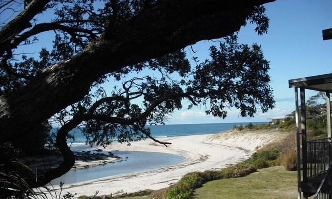 Whiritoa House | Walk straight onto the sand from the garden.