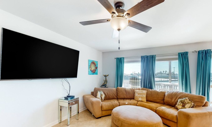 Harbor Oaks House | Waterfront condo with balcony, private boat slip, fishing pier, pools, & tennis
