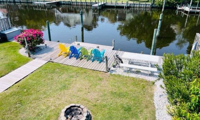 Colington Harbour House | Waterfront! Game Room, Hot Tub, Theater Room, Fire Pit, Kayaks, SUPs,YMCA,DogsOK