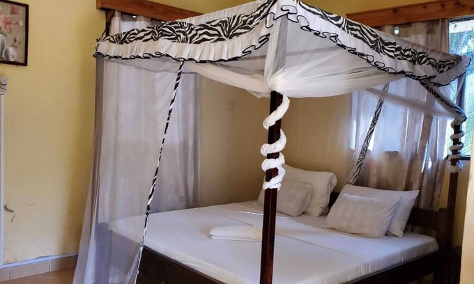 Galu Kinondo Cottage | We are located in Galu Beach opposite lantana Hotel.