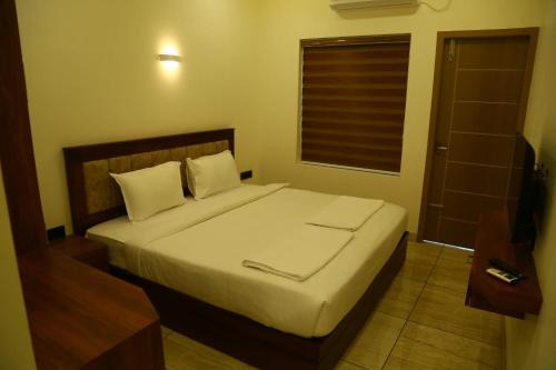 Nedumbassery Hotel | West Gate Airport Residency