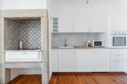Alfama Apartment | White & Blue Vintage Home in Graça
