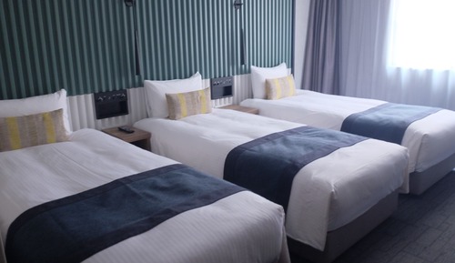 21 Sqm, Deluxe Triple Room (Bed Type: Single bed is arranged)