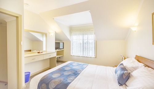 Room 21 Queen Bed with Stairs