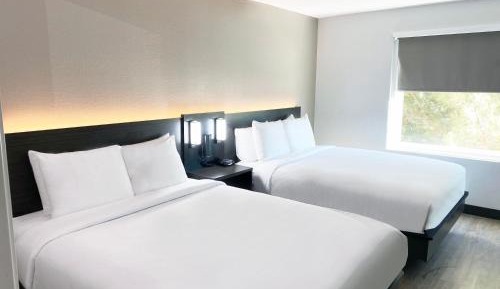 Suite with Two Queen Beds and Kitchen and Separate Bedroom - Non-Smoking