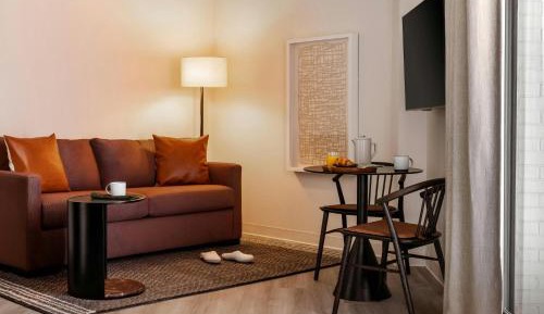 One-Bedroom Apartment with Queen and Sofa Bed and Balcony - Mobility Accessible with Roll-in Shower