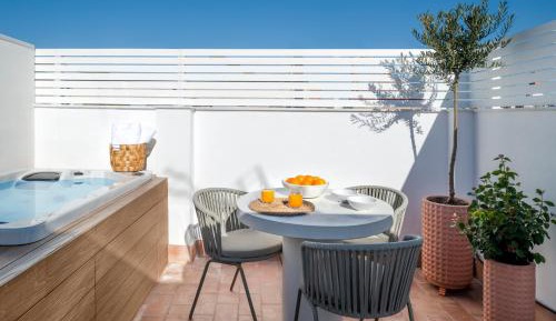 apartamento 1 dormitorio con bañera de hidromasaje privada en terraza común