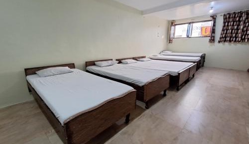 Single Bed in Dormitory Room
