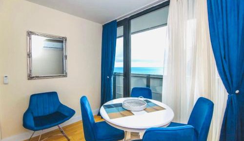 One-Bedroom Apartment with Balcony and Sea View
