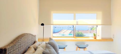 One-Bedroom Apartment with Balcony and City View