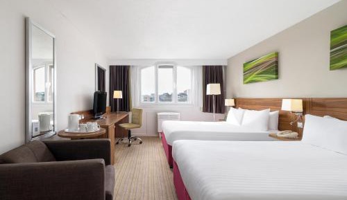 Twin room with 2 double beds and Brayford Wharf view