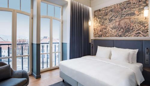 Collection Room with Balcony and Old Town View