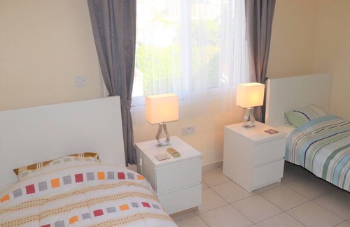 Peyia Town House | Direct access to the pool from the garden. A sandy beach is a few minutes away.