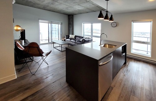 Fabreville Apartment | Corporate Stays - Elegant 3BR with Rooftop, Gym & Lounge