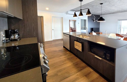 Fabreville Apartment | Corporate Stays - Luxurious 2BR with Stunning Rooftop Views Luxury & Gym Accessn