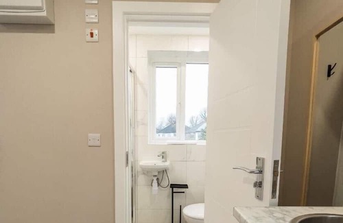 Roxeth Apartment | Private double bedroom with bathroom and amenities