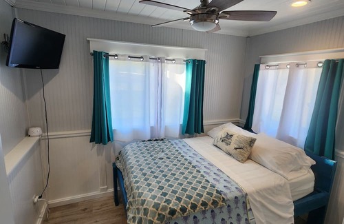 Indian River Estates Cottage | Cozy Waterfront Cottage w/ hot tub, dock & tiki