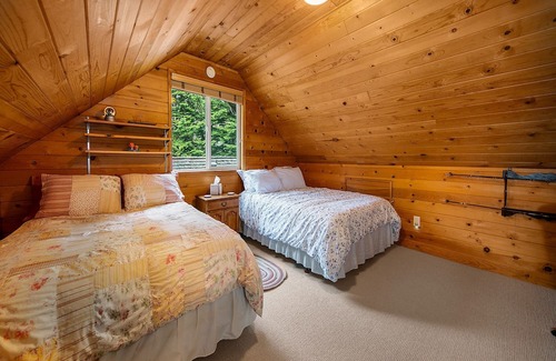 Baring Cabin | Delightful river front cabin with new hot tub and mountain views.