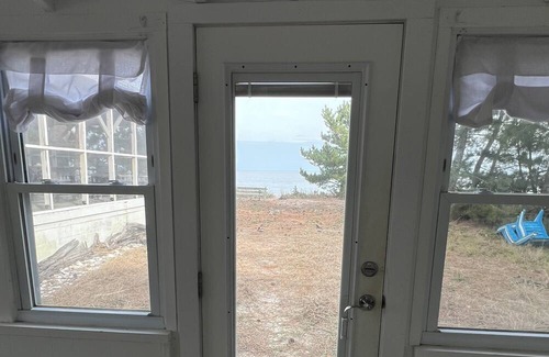 Slaughter Beach House | Beachfront Cottage with detached screened porch with stunning beach views.