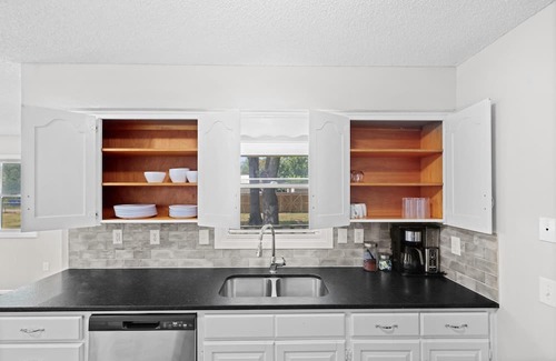 Joplin House | Stylish Rancher in Quiet, Tree Lined Neighborhood.